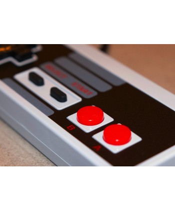 Manette Nintendo Nes de couleur grise vue plongeante.