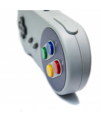 Manette Nintendo SuperNes grise vue de 3/4.